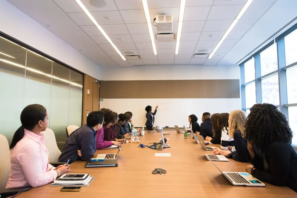 Professionals exchanging ideas around a meeting table